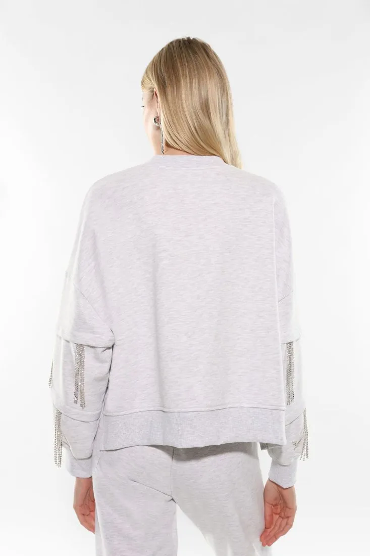 Felpa oversize con frange di strass sulle maniche